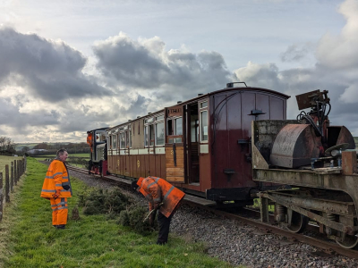 The gang, with their transport, clears yet more gorse bushes from the lineside